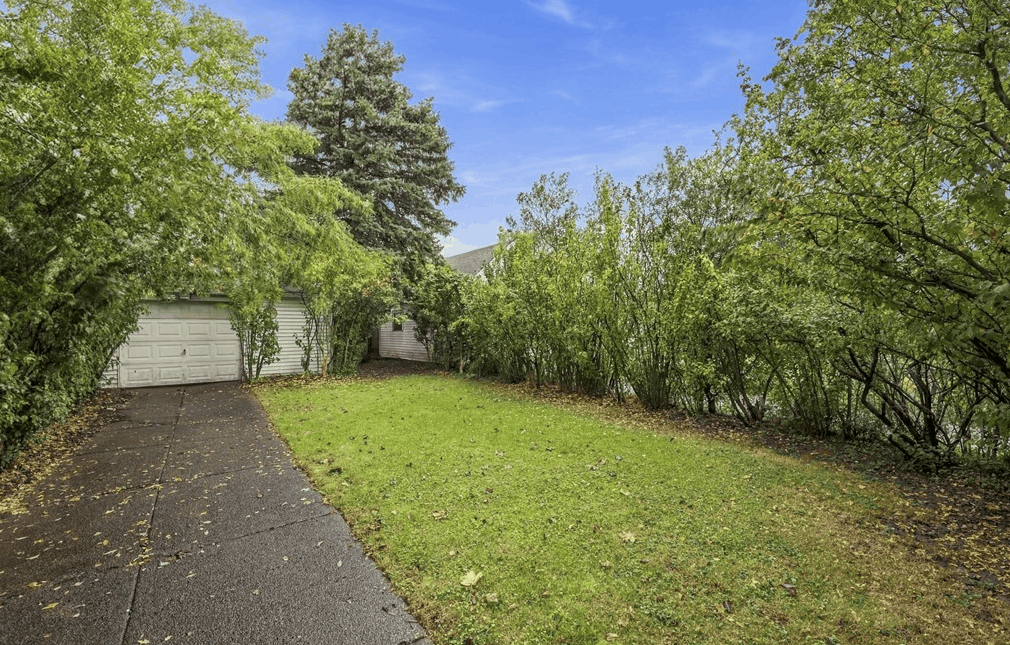 Hardwood floors and enclosed front porch sunroom at 22 Beatrice Avenue in Buffalo NY